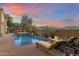 Inviting pool and spa with mountain views at sunset at 10793 E La Junta Rd, Scottsdale, AZ 85255