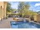 Resort-style pool with spa, outdoor kitchen, and dining area at 10793 E La Junta Rd, Scottsdale, AZ 85255