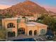 Luxury home with pool and spa, mountain views in the background at 10793 E La Junta Rd, Scottsdale, AZ 85255