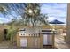 High-end outdoor kitchen with grill, refrigerator, and ample counter space at 10793 E La Junta Rd, Scottsdale, AZ 85255