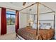 Main bedroom with canopy bed, and mountain views at 10793 E La Junta Rd, Scottsdale, AZ 85255