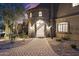 Ornate entryway with a stone facade and wrought-iron doors at 10793 E La Junta Rd, Scottsdale, AZ 85255