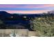 Stunning sunset views over city lights and mountain ranges at 10793 E La Junta Rd, Scottsdale, AZ 85255