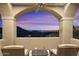 Peaceful patio with stunning sunset views and mountain backdrop at 10793 E La Junta Rd, Scottsdale, AZ 85255