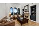 Cozy living room featuring a fireplace and built-in shelving at 10793 E La Junta Rd, Scottsdale, AZ 85255