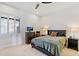 Comfortable bedroom with a plush bed and window seating at 10793 E La Junta Rd, Scottsdale, AZ 85255