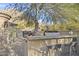 Modern outdoor kitchen with built-in grill and bar seating at 10793 E La Junta Rd, Scottsdale, AZ 85255
