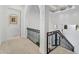 Upstairs hallway with wrought iron railing overlooking the entryway at 10793 E La Junta Rd, Scottsdale, AZ 85255