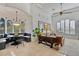 Bright living room with vaulted ceilings, large windows, and comfortable seating at 10793 E La Junta Rd, Scottsdale, AZ 85255