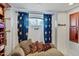 Cozy sitting area with comfortable seating and built-in shelving at 10793 E La Junta Rd, Scottsdale, AZ 85255