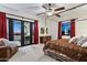 Spacious primary bedroom with a king-size bed, sitting area, and stunning sunset views at 10793 E La Junta Rd, Scottsdale, AZ 85255