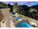 Backyard oasis with pool, spa, and outdoor dining area at 10793 E La Junta Rd, Scottsdale, AZ 85255