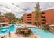 Inviting pool area with multiple pools, waterfalls, and ample seating at 12212 N Paradise Village S Pkwy # 451, Phoenix, AZ 85032