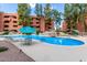 Inviting community pool with a waterfall feature at 12212 N Paradise Village S Pkwy # 451, Phoenix, AZ 85032