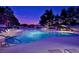 Community pool with lounge chairs and evening lighting at 12212 N Paradise Village S Pkwy # 451, Phoenix, AZ 85032