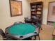 Game room with poker table and bookcase at 12212 N Paradise Village S Pkwy # 451, Phoenix, AZ 85032