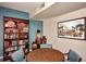 Community room with a bookcase and round table at 12212 N Paradise Village S Pkwy # 451, Phoenix, AZ 85032