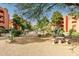 Landscaped courtyard with stone table and benches at 12212 N Paradise Village S Pkwy # 451, Phoenix, AZ 85032