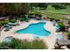 Resort-style pool with surrounding lounge chairs and umbrellas at 12212 N Paradise Village S Pkwy # 451, Phoenix, AZ 85032