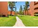 Landscaped grounds with a brick pathway and green lawns at 12212 N Paradise Village S Pkwy # 451, Phoenix, AZ 85032