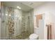 Large walk-in shower with pebble tile and glass enclosure at 12212 N Paradise Village S Pkwy # 451, Phoenix, AZ 85032