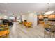 Open living room with kitchen access, tile floors, and balcony view at 12212 N Paradise Village S Pkwy # 451, Phoenix, AZ 85032