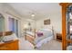 Bright bedroom with wood furnishings and sliding door access at 12212 N Paradise Village S Pkwy # 451, Phoenix, AZ 85032