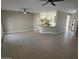 Open concept living room and kitchen with tile floors at 20117 N Portico Way, Surprise, AZ 85387