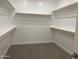 Large walk-in closet with ample shelving and hanging space at 20117 N Portico Way, Surprise, AZ 85387