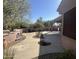 Backyard with a patio, fireplace, and mature trees at 20117 N Portico Way, Surprise, AZ 85387