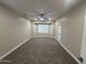 Large bedroom with bay window, carpet and ceiling fan at 20117 N Portico Way, Surprise, AZ 85387