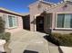 Front entrance with a covered patio and landscaping at 20117 N Portico Way, Surprise, AZ 85387