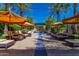 Resort-style pool with lounge chairs and umbrellas at 1768 E Grand Ridge Rd, Queen Creek, AZ 85140