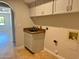 Convenient laundry room with cabinets and a sink at 2158 N Yale --, Mesa, AZ 85213