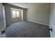 Well-lit bedroom with carpet and window at 2158 N Yale --, Mesa, AZ 85213
