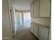 Bright hallway with neutral carpet and built-in storage at 2158 N Yale --, Mesa, AZ 85213
