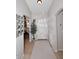 Bright and airy entryway with tile flooring, a mirror, and a view into another room at 3771 E Hazeltine Way, Chandler, AZ 85249