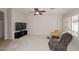 Spacious living room with neutral decor, plush seating, and a large TV at 3771 E Hazeltine Way, Chandler, AZ 85249
