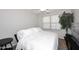 Bright bedroom with a double bed, side table, and ceiling fan at 3771 E Hazeltine Way, Chandler, AZ 85249