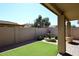 Backyard with fountain, artificial turf and covered patio at 3771 E Hazeltine Way, Chandler, AZ 85249