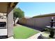 Backyard with fountain, artificial turf and covered patio at 3771 E Hazeltine Way, Chandler, AZ 85249