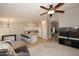 Open kitchen with island seating, white cabinets, and modern appliances at 3771 E Hazeltine Way, Chandler, AZ 85249