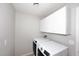 Laundry room with washer, dryer, and cabinets at 3771 E Hazeltine Way, Chandler, AZ 85249