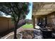 Backyard with fountain, artificial turf and covered patio at 3771 E Hazeltine Way, Chandler, AZ 85249