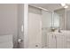 Bathroom features double sinks, a shower, and white cabinets at 3771 E Hazeltine Way, Chandler, AZ 85249