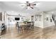 Open dining area with wood table and chairs, adjacent to living room at 11876 W Nadine Way, Peoria, AZ 85383