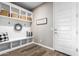 Laundry room with white cabinets and built-in bench at 11876 W Nadine Way, Peoria, AZ 85383