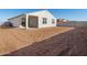 Landscaped backyard with a large grassy area at 37517 W San Clemente St, Maricopa, AZ 85138