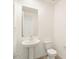 Clean bathroom with pedestal sink and toilet at 37517 W San Clemente St, Maricopa, AZ 85138