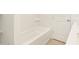 Clean bathroom with a bathtub and neutral colored tile at 37517 W San Clemente St, Maricopa, AZ 85138